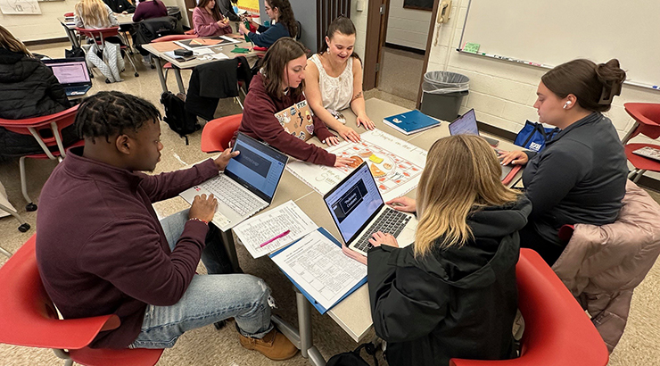 students gathered around a table
