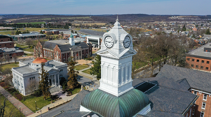Drone photo of KU's clock tower focusing on the angle that shows an angry chicken face.