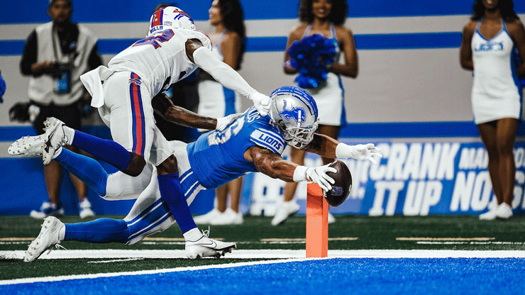 KU alumni Craig Reynolds making a touchdown playing for the NFL's Detroit Lions in a preseason game.