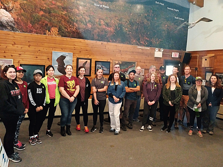 Data analytics students visit their data source at Hawk Mountain.