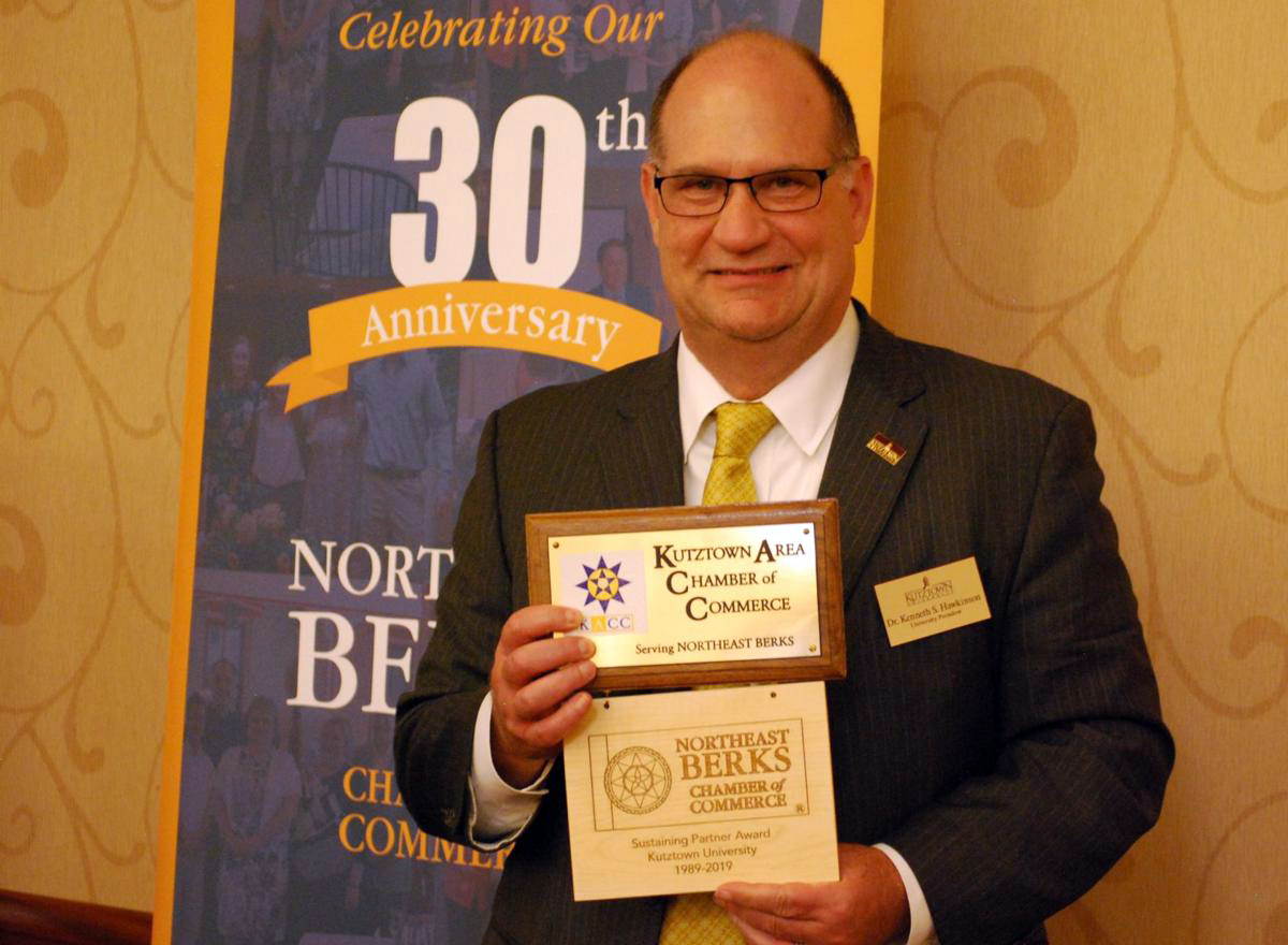 Kutztown University president Dr. Kenneth Hawkinson accepted the Sustaining Partner Award by the Northeast Berks Chamber of Commerce. 