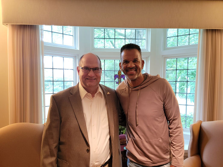 Kutztown University president, Kenneth Hawkinson, and Pro Football Hall of Famer, and KU alumnus, Andre Reed pose for photo op. 