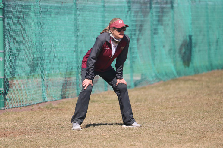 Photo of coach Judy Lawes in a softball field.