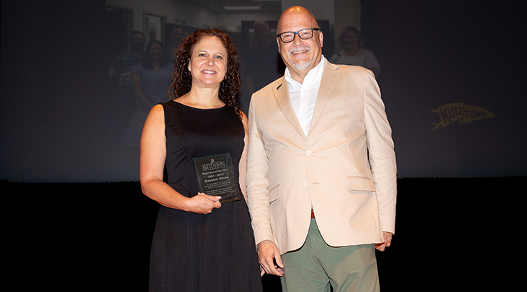 President Cavalier presents employee of the year award to Heather Klotz