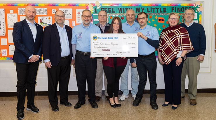 Officials from two organizations for check presentation.