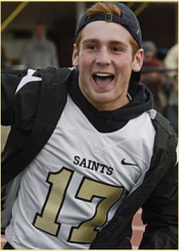 Image of joyful, Anthony Myers wearing black windbreaker over number 17, Saints football jersey.