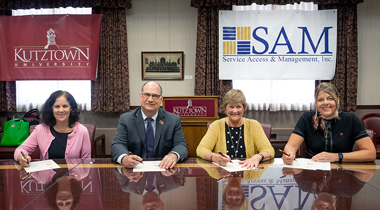 Service Access and Management Officials signing agreement