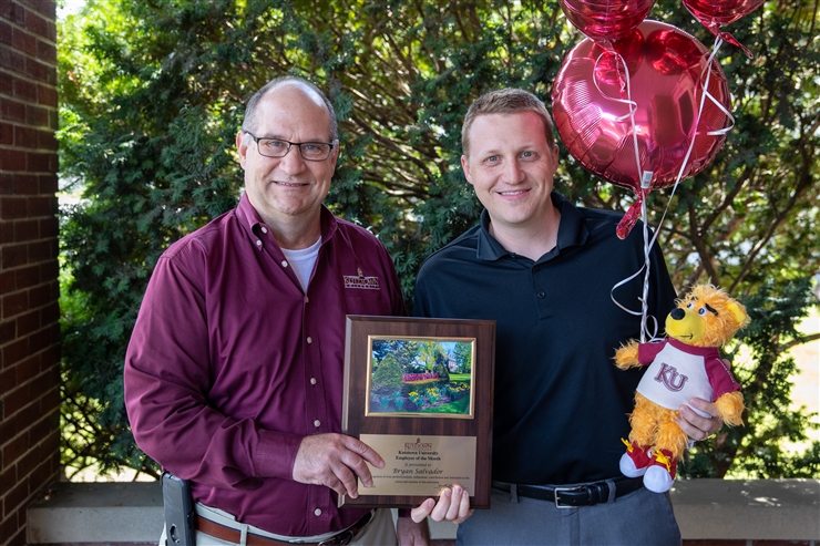 A photo of President Hawkinson (left) with Bryan Salvadore (right).