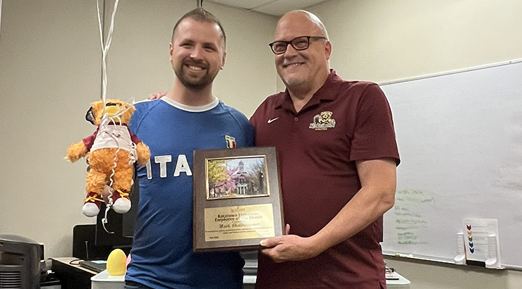 Shellhammer accepting awards from President Cavalier