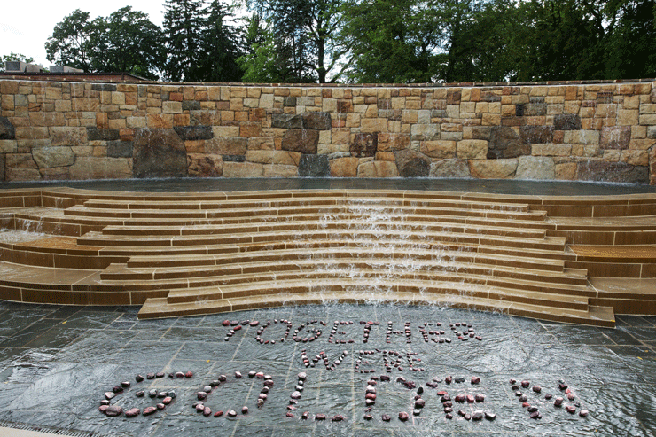 Photo of the fountain at Alumni Plaza, Kutztown University. Together We're Golden spelled out with rocks.