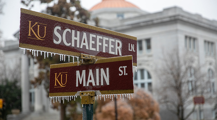 Schaeffer Ln. and Main St. intersection street signs with ice 