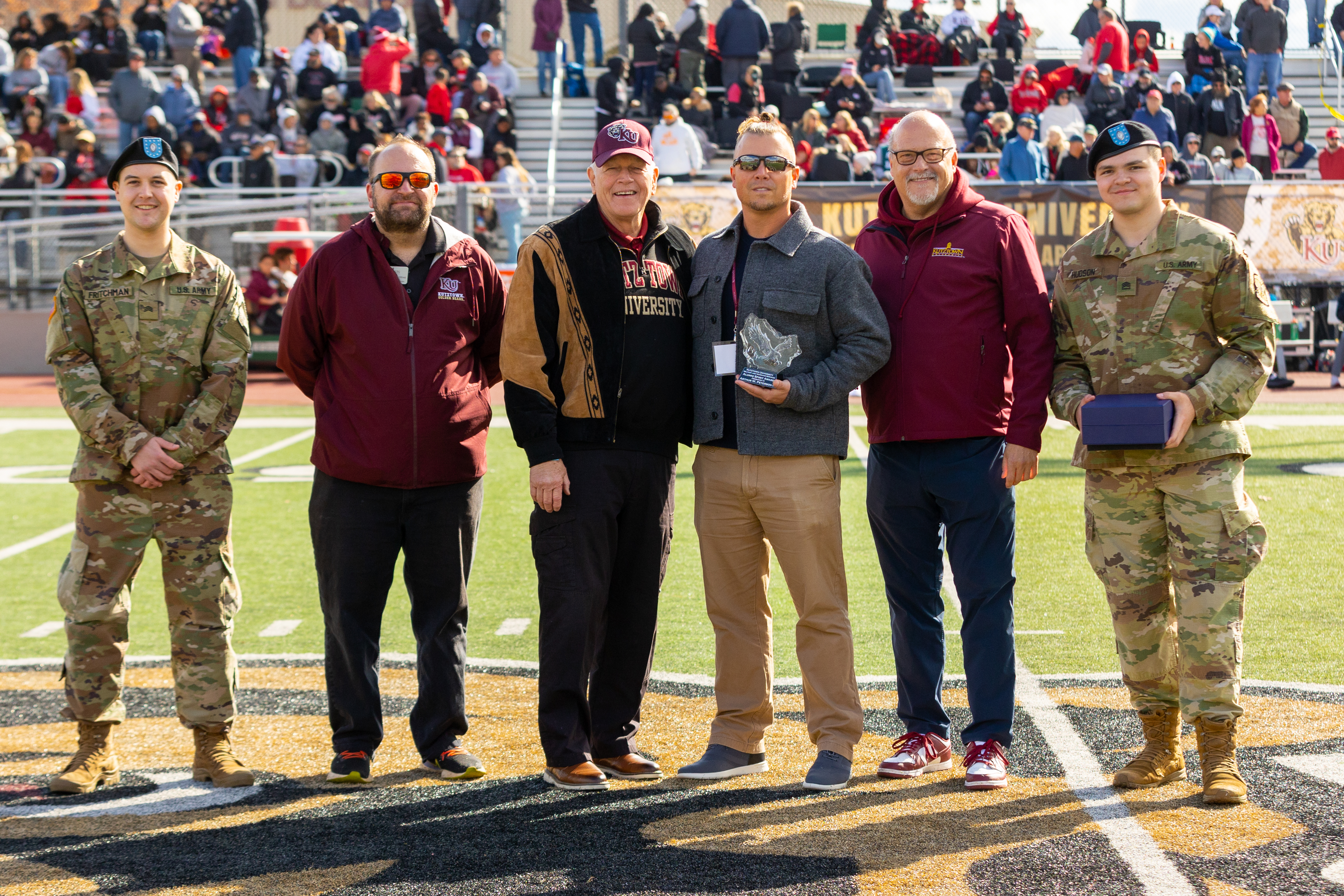 President Hawkinson receives 2024-2025 Veteran Alumni Spirit Award next to Mrs. Hawkinson.