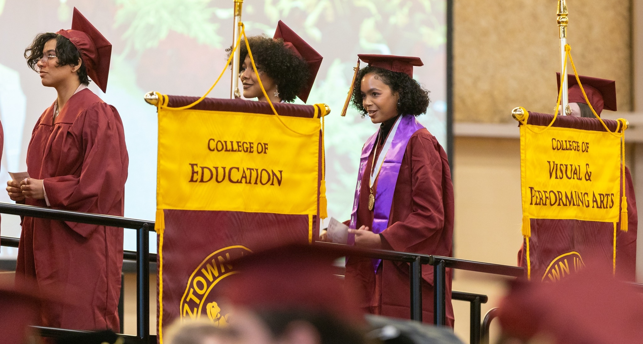 December 2023 students and college gonfalons