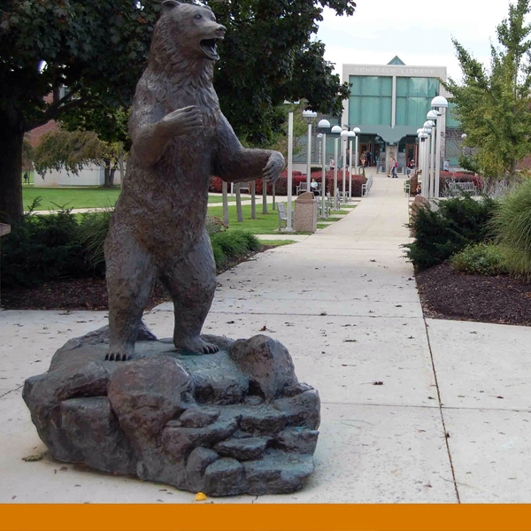 image of the golden bear statue in front of the library