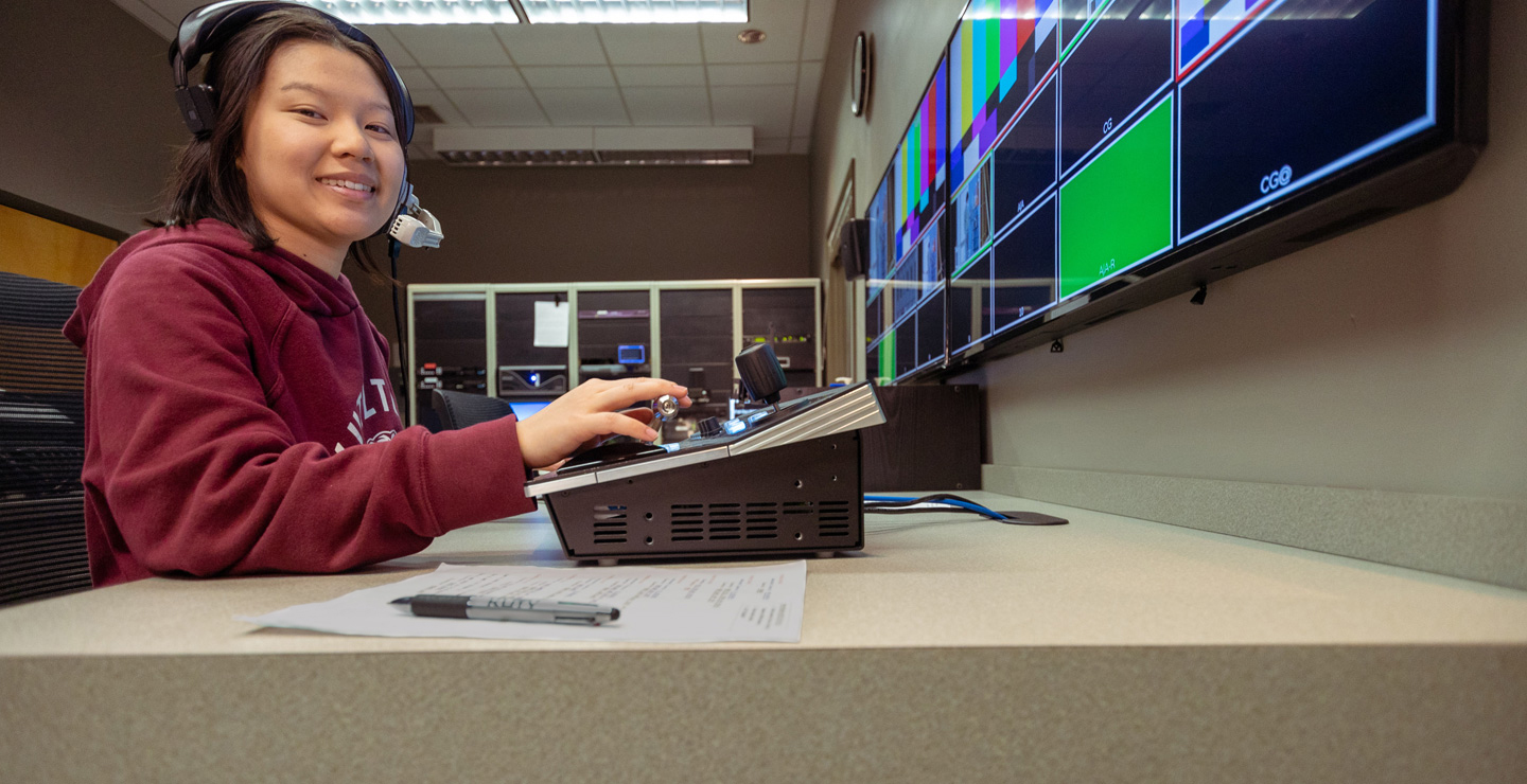 Cinema, Television and Media Production Major Victoria working in the TV control room