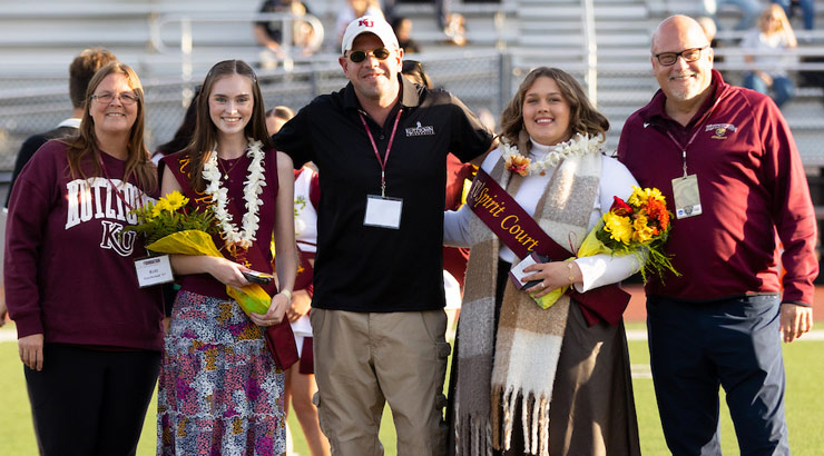 members of the homecoming spirit court with President Cavalier.