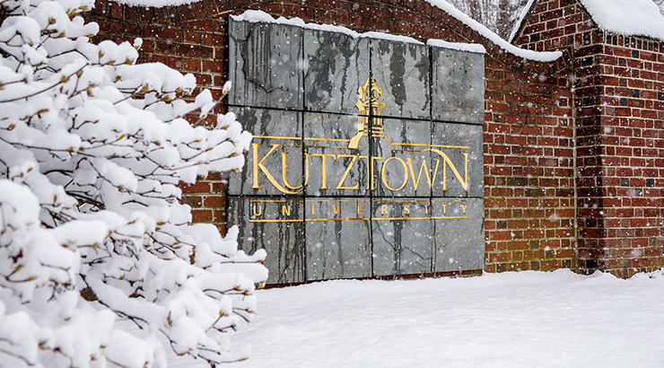 snowy scene showing the Kutztown welcome sign.