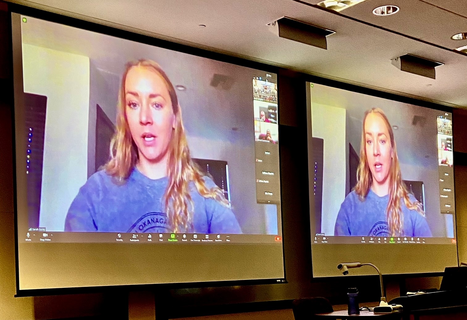 Sarah Bailey over zoom, broadcasted on two smart boards next to each other in a lecture hall 