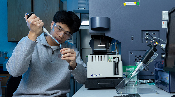 Student loading a pipette