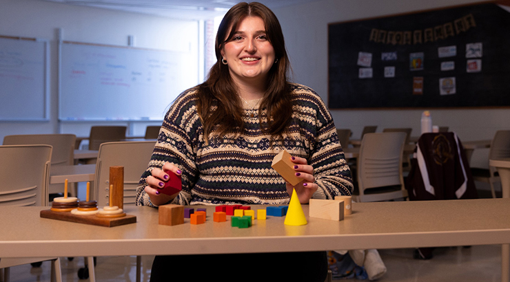 Female student playing with blocks