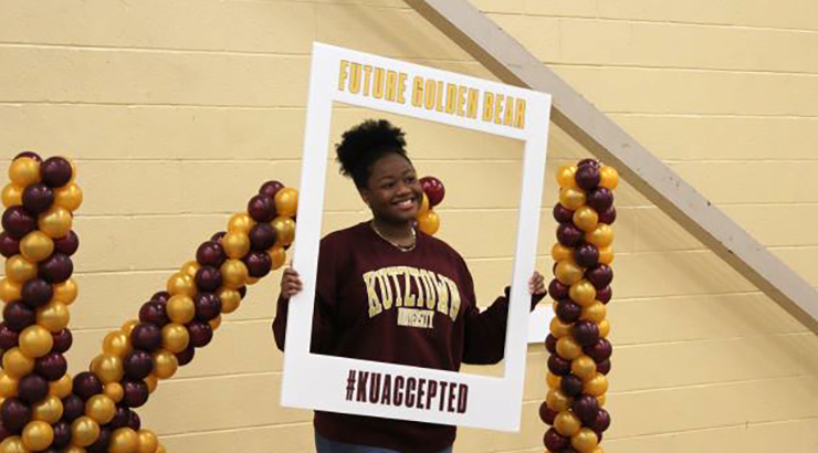 Person holding large picture frame