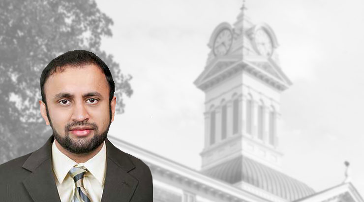 Headshot of Dr. Fawad S. Rafi over a black-and-white image of the Old Main clock tower