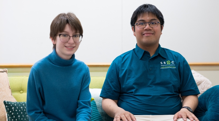 Two students in front of a class