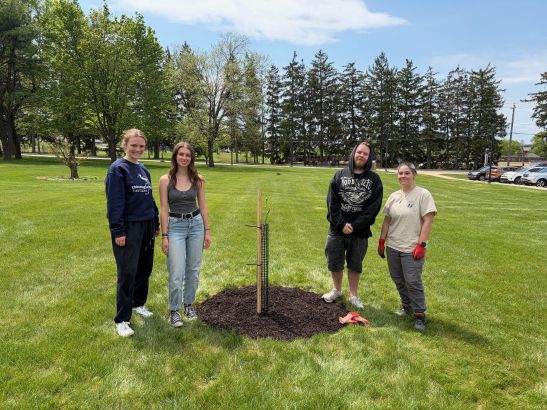 KU Plant Club near a tree