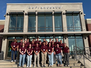 Group photo outside de Francesco