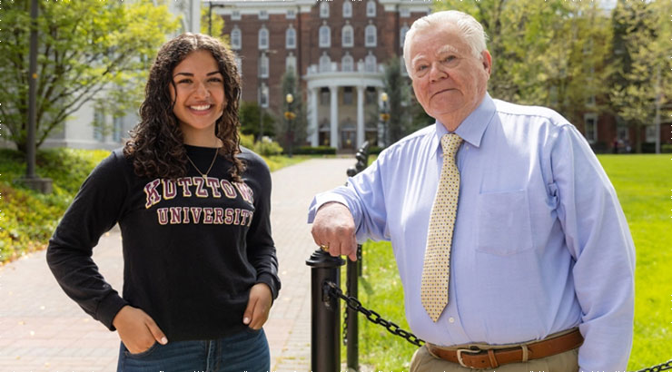 Alexandra Coleman and Dennis O’Donnell 2022 Kutztown University Graduates in front of Old Main