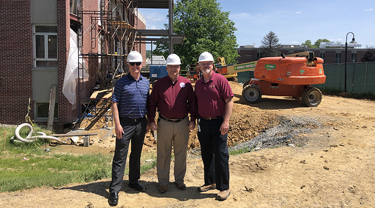 President Kenneth Hawkinson, vice president Matt Delaney and interim director of Facilities Project Services Bill Leech in front of the renovation of the de Francesco building