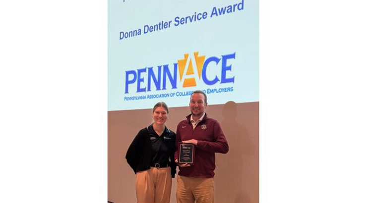 Chad Ganley and woman with award