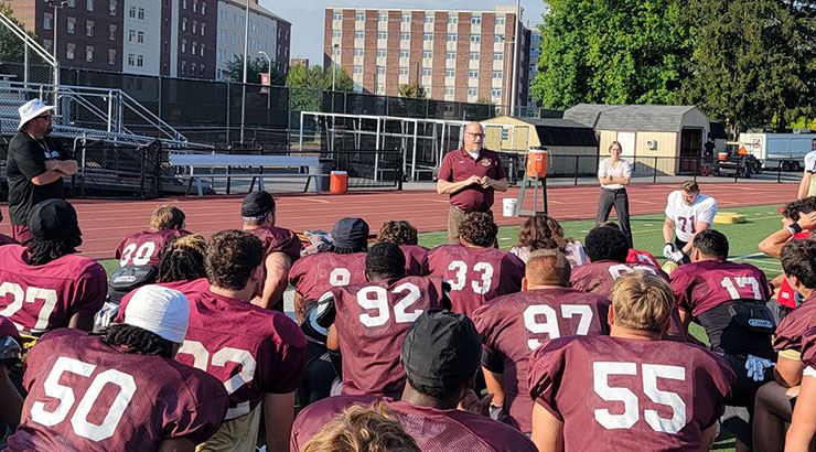 Dr. Cavalier meets football players