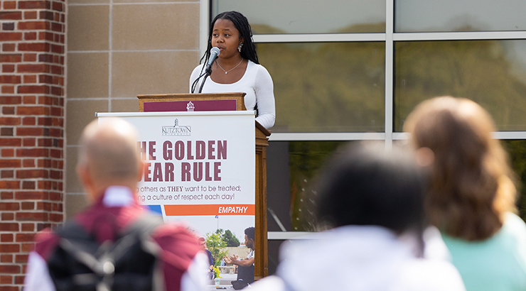 Student speaking at podium