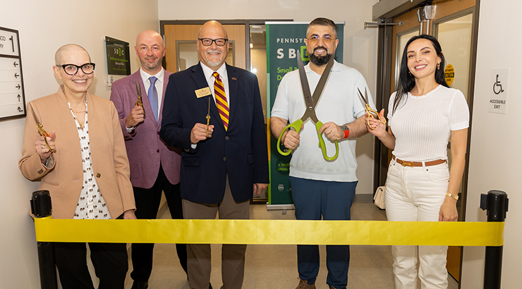 Group photo cutting ribbon