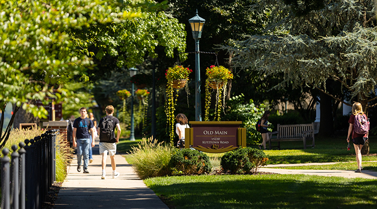 Students walking in front of Old Main