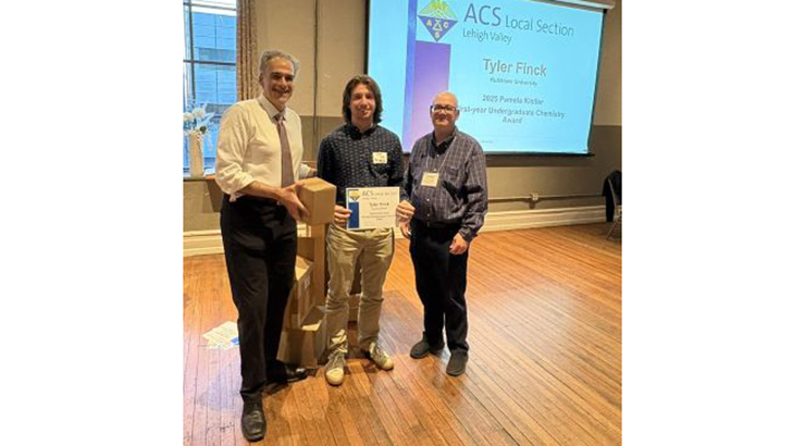 Tyler Finck receiving award