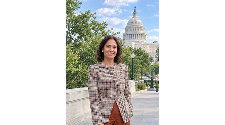 Dr. Yasoda Sharma with Capitol in background