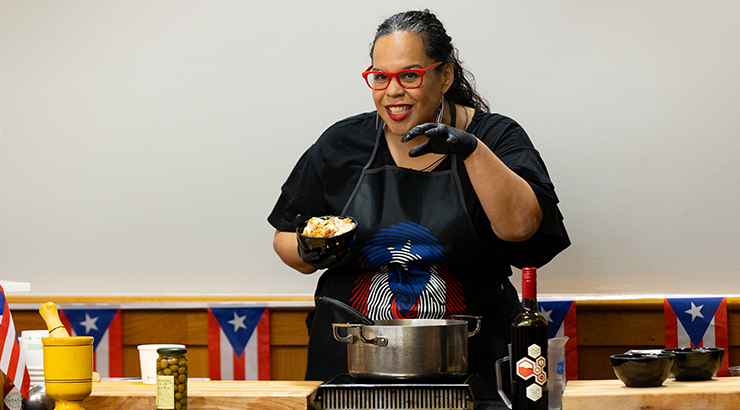 Melinda Quinones-Arias hosting a cooking demonstration