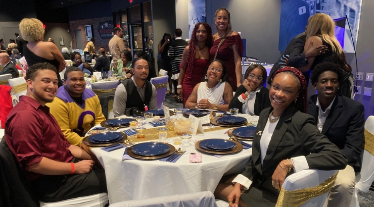 group of students sitting at a table