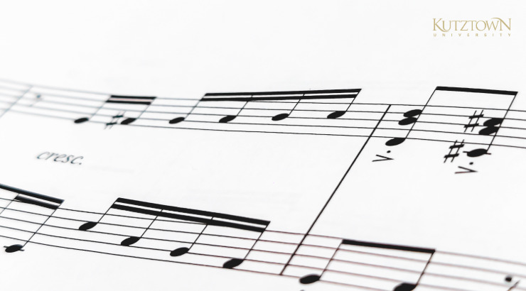 Graphic of music notes, with Kutztown University logo in bottom-right corner