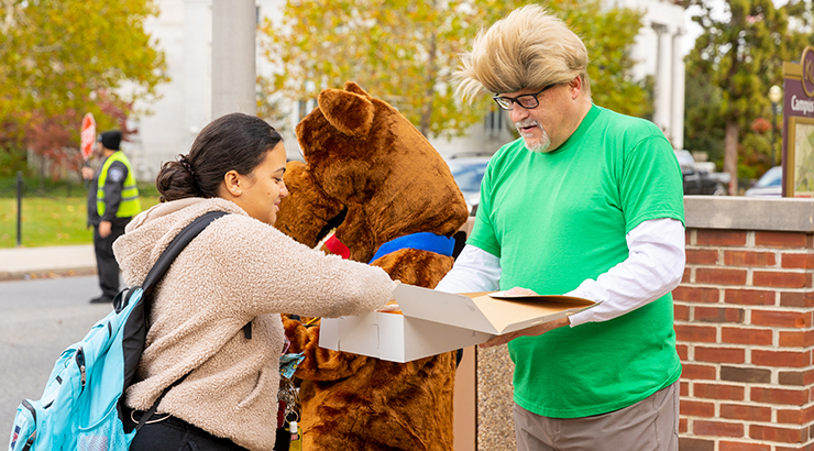 Cavalier giving donuts to students