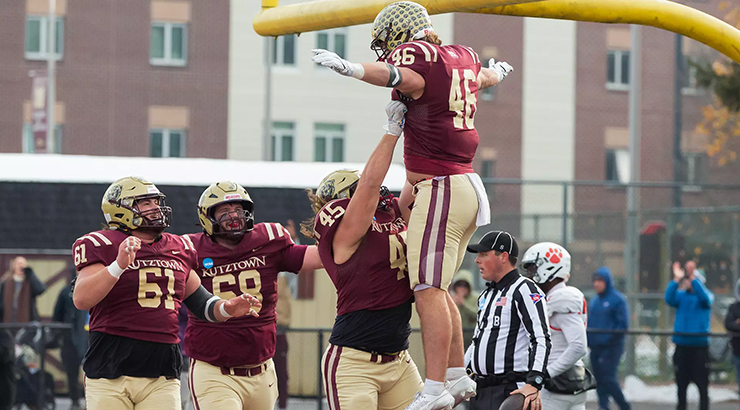 Football players celebrating on field