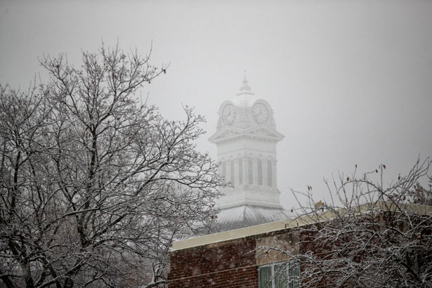 Photo of the KU clock tower on a gray foggy day