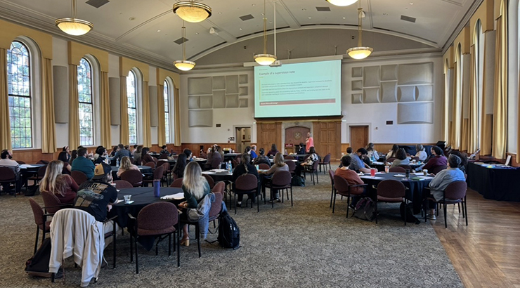people in room looking at a Power Point screen
