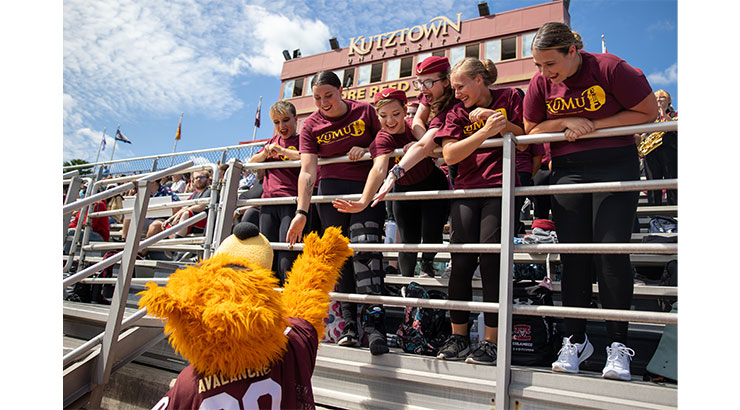 Avalanche with students dressed in maroon and gold