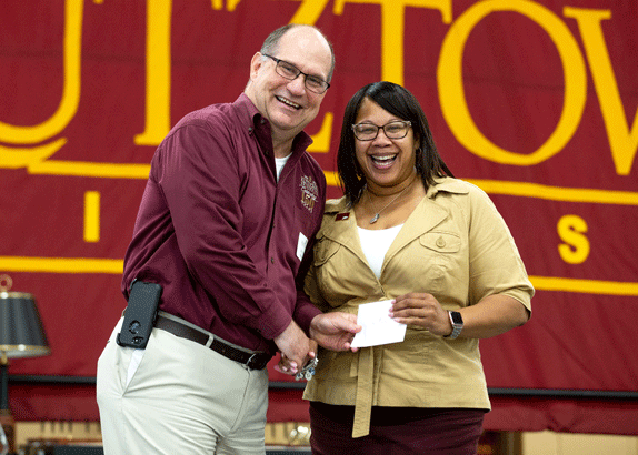Photo of President Hawkinson and Toyia Heyward at a previous Faculty Staff Appreciation luncheon