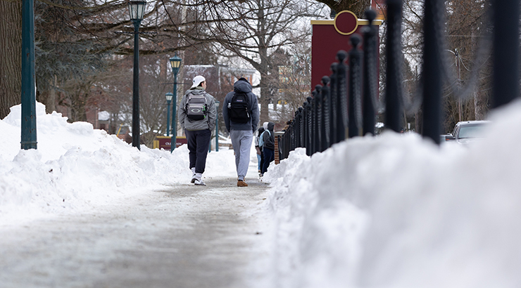 Students walking on campus in snow