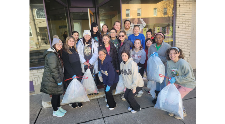 photo of a group of students with trash bags