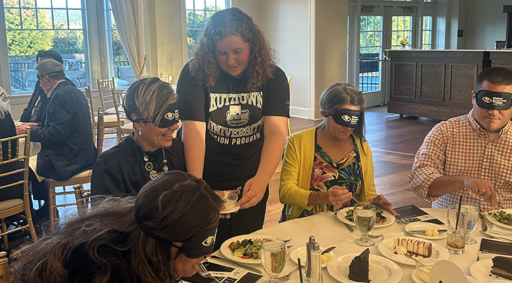 photo of people in sleep masks eating dinner